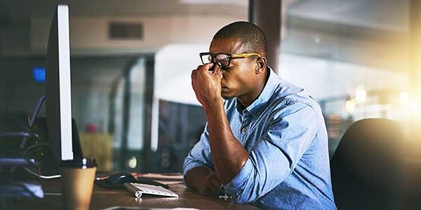 Man Financially stressed at work