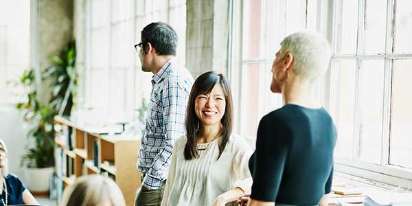 Employees chatting at work